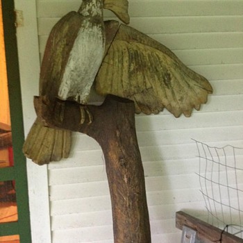 antique carved cockatoo?  maybe an entrance sign?