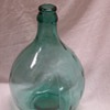 Large blue glass jug bubbles in glass