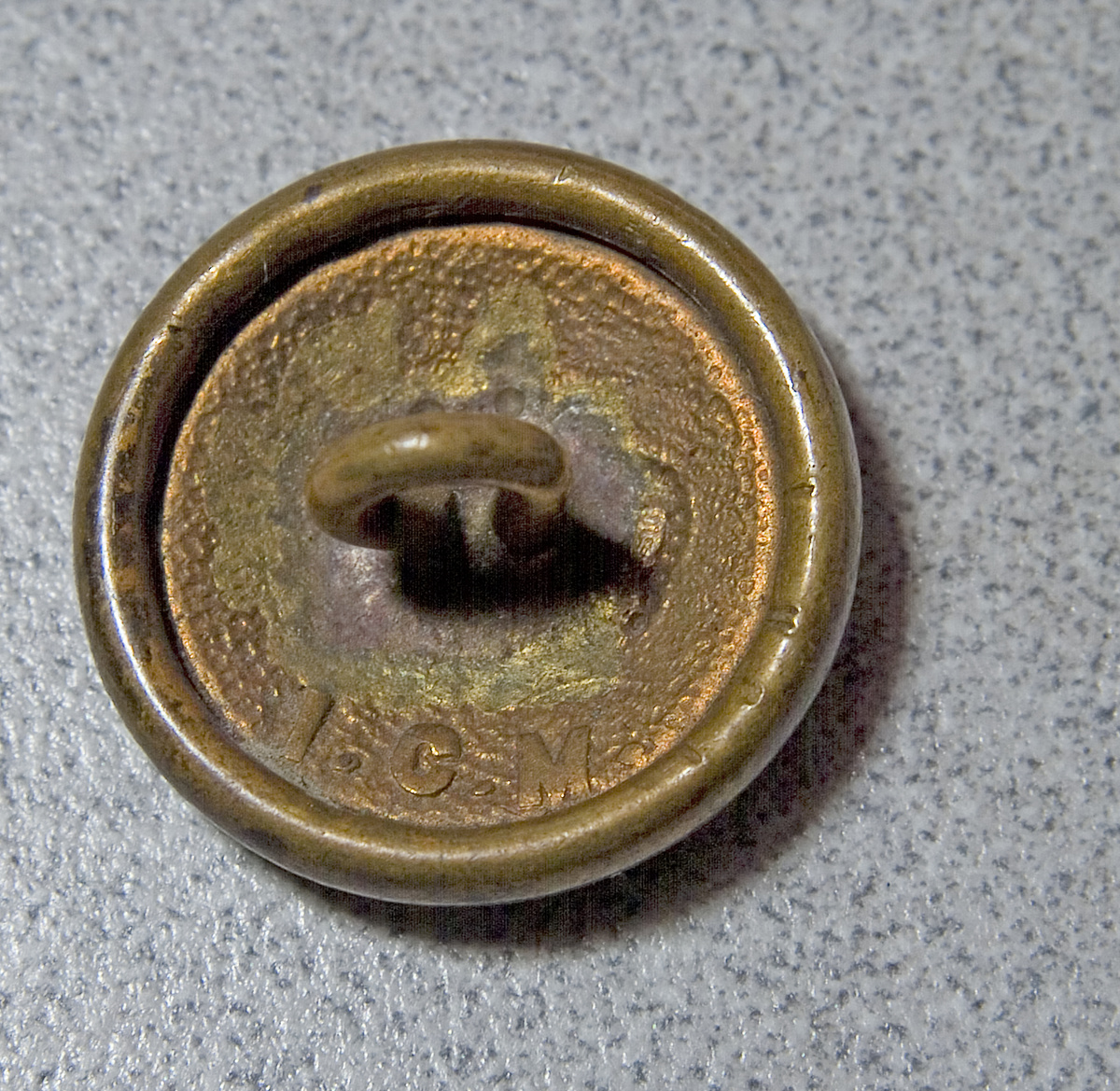 Brass button with crown reverse has I.C.M. Collectors Weekly