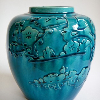 Vintage Japanese pottery vase with relief design