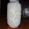 old possibly chinese pierced porcelain and wood table lamp, would love more info and value