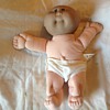 Cabbage patch baby with black head and white body...has anyone else encountered this?