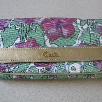 Anyone know how old or the pattern name of this coach wallet?