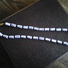 blue and white koi beads on knotted blue silk