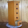 87 year old wooden box with 5 drawers complete with knobs.