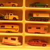 Cars in the display case with plastic curtail removed...To a kid in the 60's, captivating...Kids today...not even a glance!