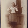 Cabinet card of toddler on wall mounted telephone