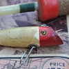 Wood lure with glass eyes.  But who made it?