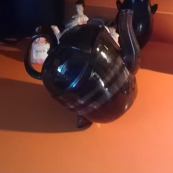 Tilting teapot and Enesco prayer ladies
