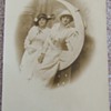 RPPC of women with "Man in the Moon" prop