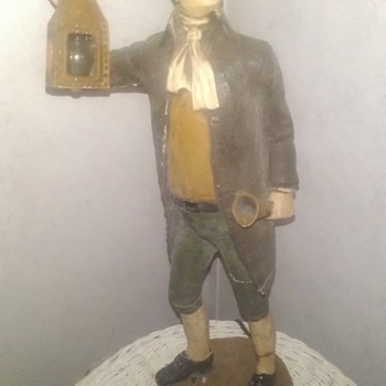 Colonial man holding lamp