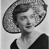 Looking for age of a hat in this photo. Black lace with rose. Very stylish.