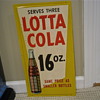Lotta Cola embossed sign 