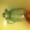An original thermos jug decanter in stainless steel with glass inside and a cork stopper