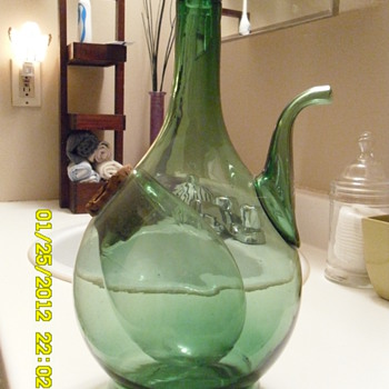 some kind of wine bottle?...with a place for ice? let me know please... - Bottles