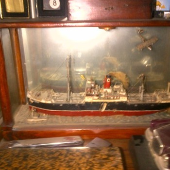 old ship in wood frame and glass around