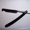 An antique razor labeled 222 WH Morely & sons