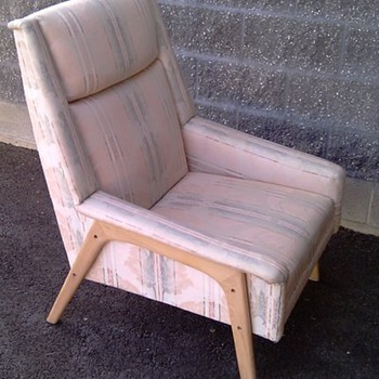 Badly upholstered Dux chair.
