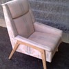 Badly upholstered Dux chair.