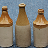 ---Old Tan and White stone wear beer bottles---
