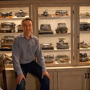 Sitting with my collection of antique typewriters - Office