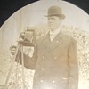 Photographer with his camera on a tripod