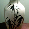 Yellow vase with  black design 