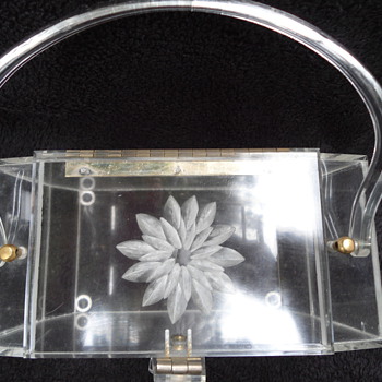 vintage clear lucite handbag with handles and floral carving