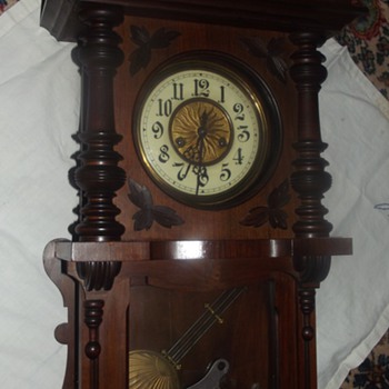 German 8 Day Clock with Porcelain Numbered Face