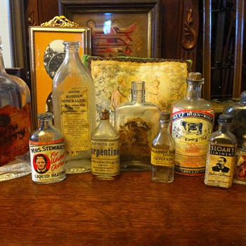 Antique glass bottles with lables