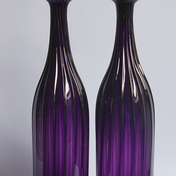 A pair of amethyst decanters