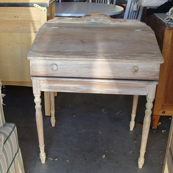 childs slant top desk with scroll inserted 