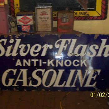 silver flash gasoline sign