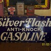 silver flash gasoline sign