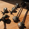 Silver snails, seperately and on a spoon and fork. 