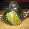 Glass paperweight of conjoined ducks.