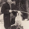 Photograph of Hunter with Shotgun, his dog and dead racoon