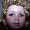 Two dolls on looks real old but very dirty
