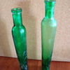 Narrow green bottles