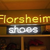 Here's a couple old neon signs I own. Florsheim Shoes and Plastering sign