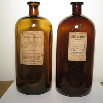 A pair of Cough Medicine Bottles