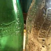 old green pepsi bottle and clear pepsi bottle