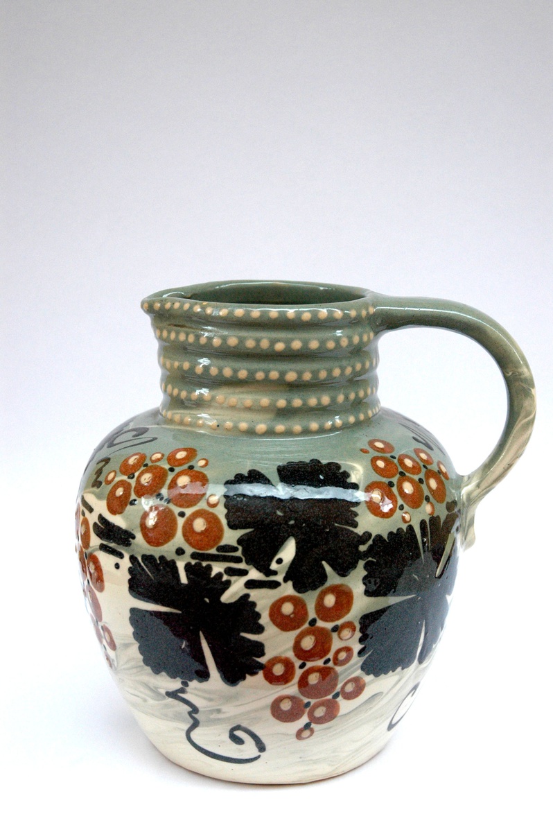 french art nouveau pottery pitcher with vineyard pattern by LEON