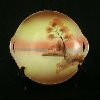 Meito China 8" handled plate with hand painted cottage on lake scene - China and Dinnerware