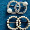 Two brooches