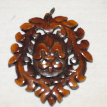 Any history of what this carved wood piece of jewelry is? - Fine Jewelry