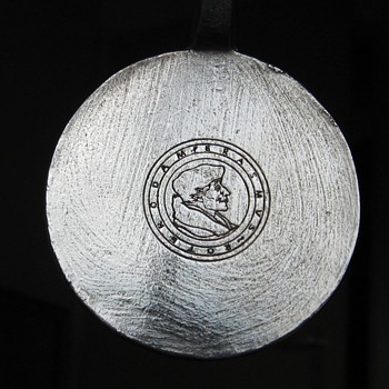 Silver (Spoonlike thing) seems very old. with a portrait.