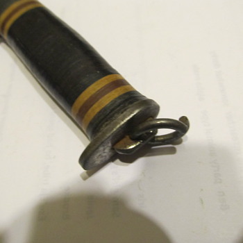 Mystery Knife with stacked leather handle and flat metal butt???