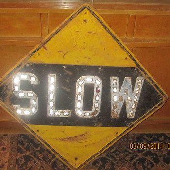 old slow sign saved from being used as a fire pit lid