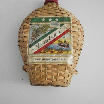 Vintage weaved cane bamboo bottle